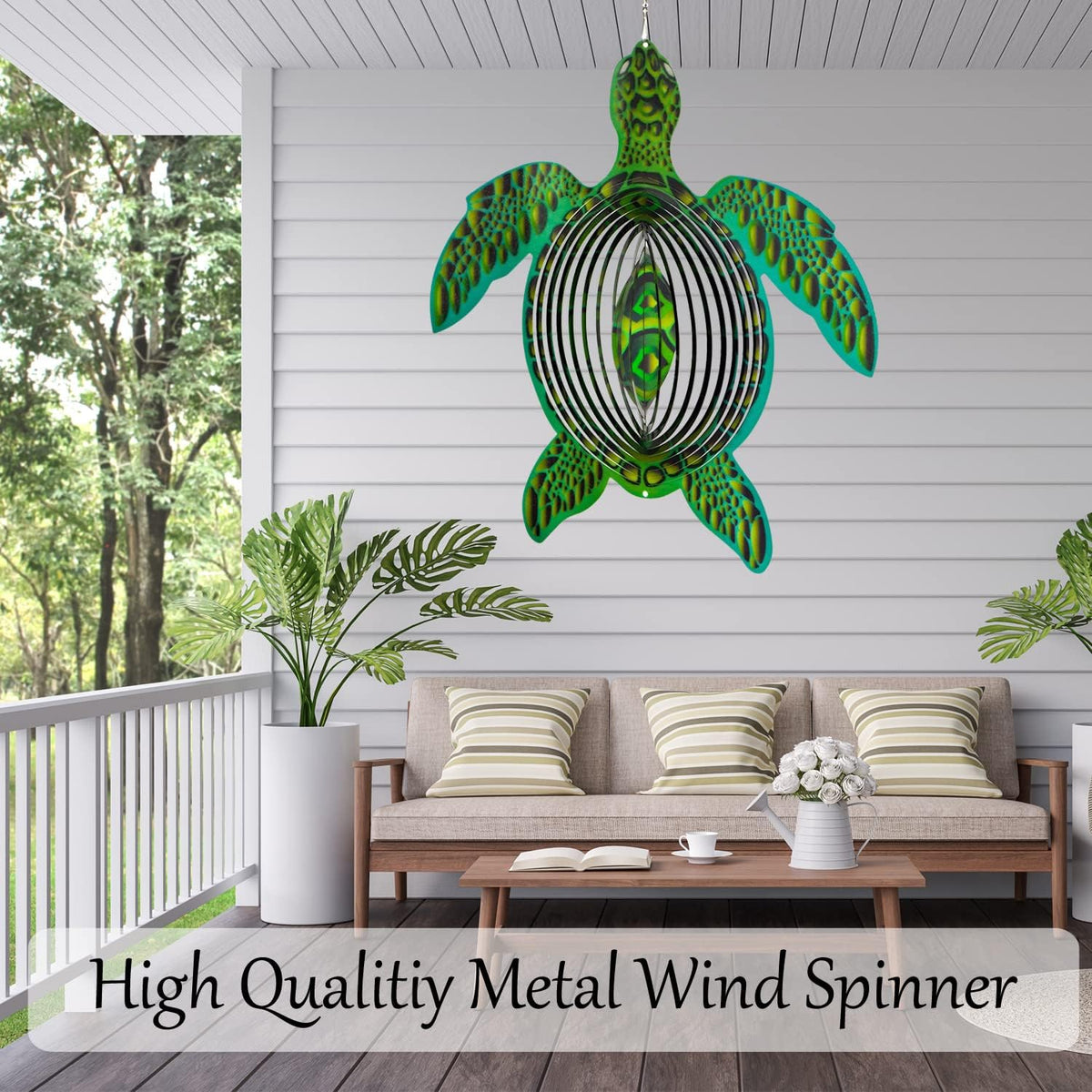 XL turtle wind spinner hanging on a porch