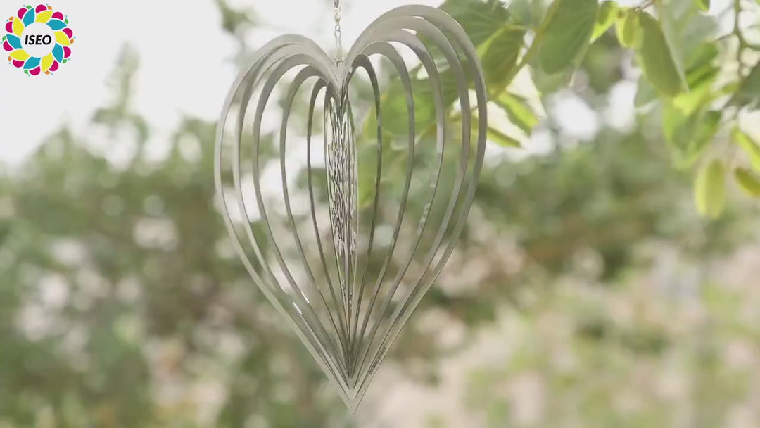 Silver Heart wind spinner turning in the breeze outdoors